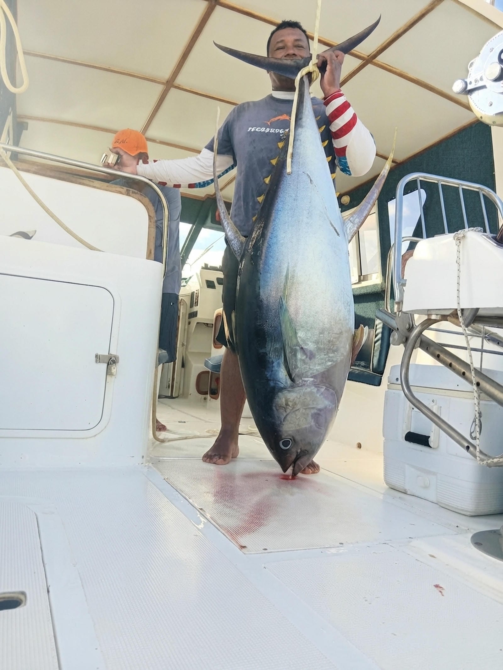 Angler Holding Yellowfin Tuna Corsaire Boat